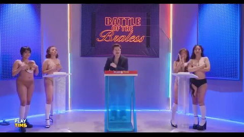 Topless Asian girls in stockings on Battle of the Breasts game show stage