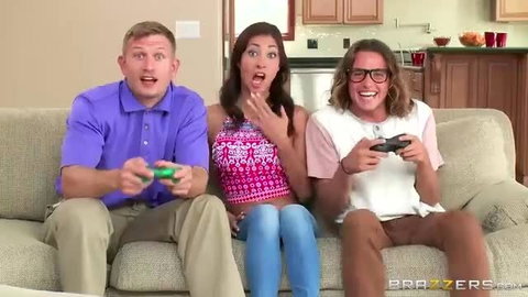 Jade Jantzen shocked between Bill Bailey & Tyler Nixon playing joysticks on couch