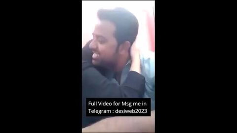 Indian man hugs girlfriend from behind, showing off assets in intimate embrace