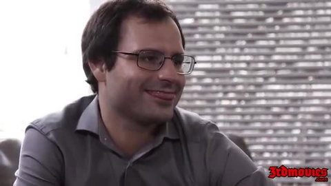 Smirking Latino man in glasses from MILF cuckold video