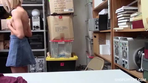Blonde Emma topless in short skirt in office storage room