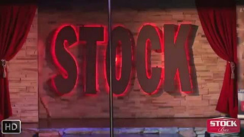 Bare Strippers 1 neon sign on brick wall with red curtains, strip club stage