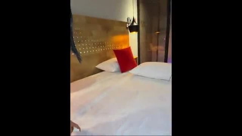 Zui Lu on hotel bed with red pillow, sexy tease pose