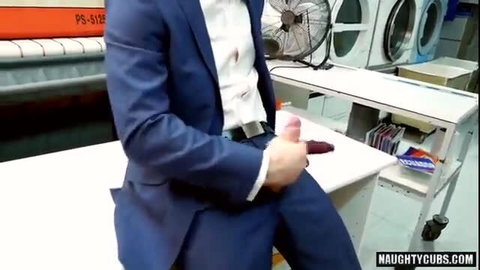 Suited Brazilian man stroking thick dildo in queer fetish solo
