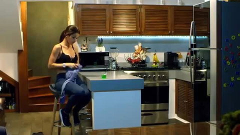 Maria Torres in black bra, topless cleavage in kitchen, erotic tease