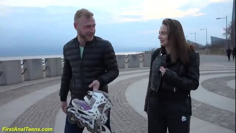 Kristi with boyfriend holding inline skates by lake, outdoor tease