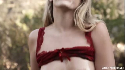 Blonde babe in red lace lingerie smiling outdoors, natural tits
