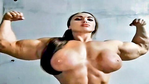 Muscular Asian bodybuilder flexing huge bare tits and biceps