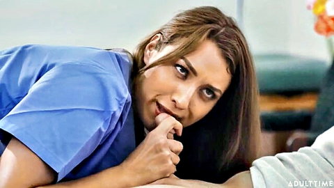 Jennifer White as seductive nurse in blue scrubs, teasing bite