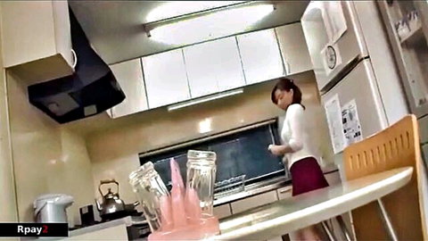 Asian MILF in white blouse and red skirt in kitchen, incest tease