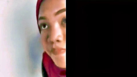 Southeast Asian hijab teen with seductive eyes and plump lips in sensual closeup tease