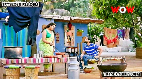 Desi bhabhi in green saree cooks teasingly with man in village, Indian adult scene