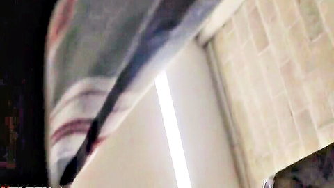 Blurry amateur upskirt tease of striped shower curtain in bathroom