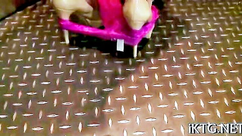 Babe squats with pink panties aside exposing shaved pussy peeing into pink toilet