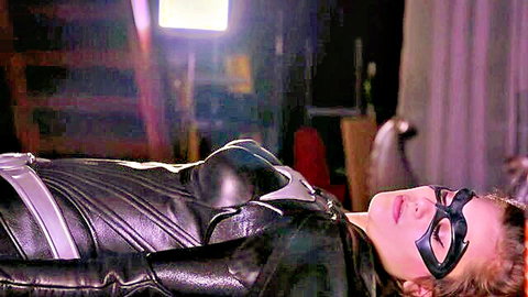 Seductive Catwoman in black leather catsuit lying provocatively