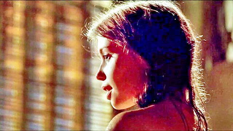 Young brunette in topless side profile from celebrity nude scene compilation