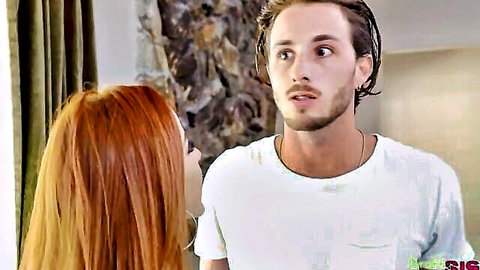 Vanna Bardot chats intimately with handsome guy in white shirt, red hair flowing