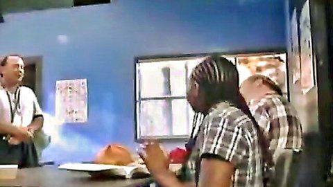 Diverse group in classroom scene on porn movie set, clothed tease