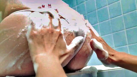 Curvy Asian babe in shower, big ass soaped and spread by hands