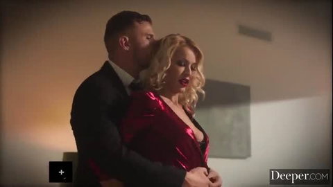 Suited man embraces busty blonde in red dress, intense couple foreplay
