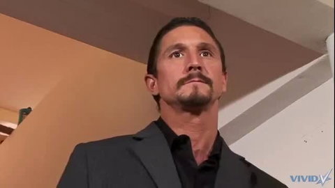 Tommy Gunn in suit looking up, closeup portrait
