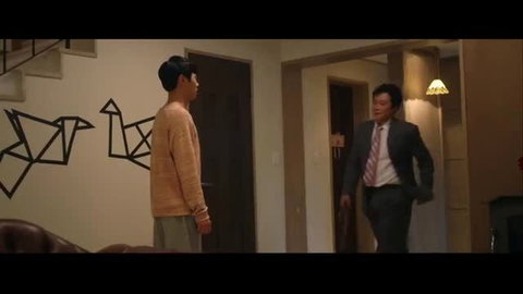 Korean stepmom in suit talks with teen son in sweater at home