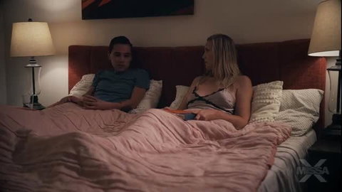 Lilly James in lingerie with man in bed, intimate MissaX scene