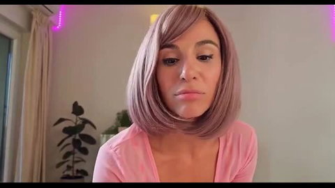 Pink wig Barbie in pink top closeup face, sensual blowjob thumbnail