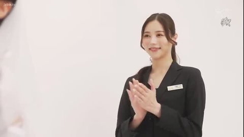 Asian bride planner Shiramine Miu clapping in suit, JAV wedding tease