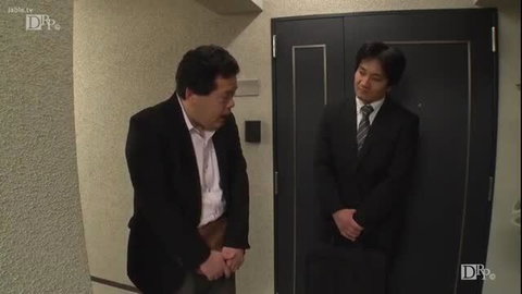 Japanese businessman bows submissively to suited man at door in JAV debt blackmail scene