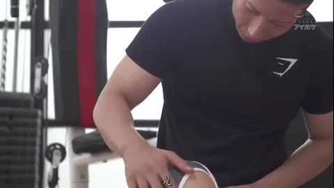 Asian gym guy holding shake in G-Star tee, muscular arms