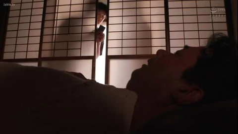 Japanese man peeking through shoji screen at sleeping man in JAV scene