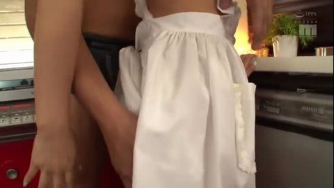Japanese maid in apron groped from behind in kitchen by masseur
