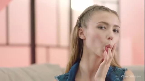 Mila Azul teases with tongue out in denim vest closeup