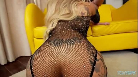 Busty blonde shemale Vanessa Jhons in sparkly fishnet bodysuit