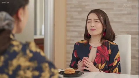 Asian MILF in floral cleavage dress at table with donut, JAV seduction