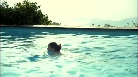Anne Ratte-Polle nude swimming in pool, topless scene from Halbschatten