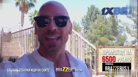 Bald handsome man in sunglasses smiling on sunny balcony promo