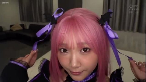 Pink-haired cosplayer Himesaki Hana in gothic lolita outfit closeup
