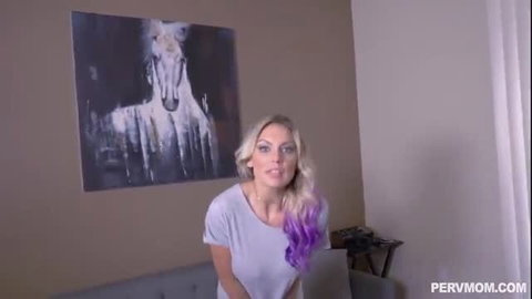 Kenzie Taylor blonde with purple hair smiling in POV bedroom tease