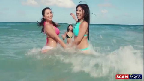 Asian babes Cindy Starfall in pink, green bikini in beach water