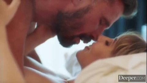 Manuel kisses Lena passionately in bed, nude intimate moment