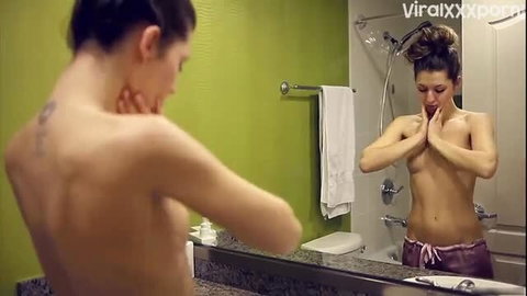 Slim brunette Lucy masturbates nude in shower, hands on tits