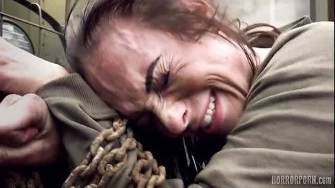Woman in chains screams in ecstasy during brutal horror porn facefuck