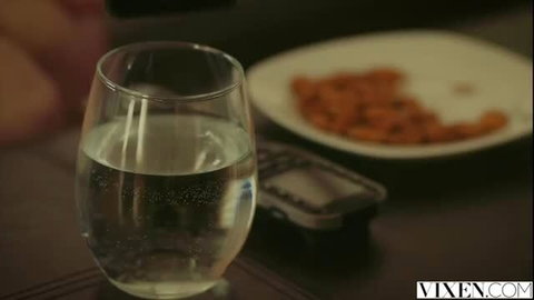 Lily Rader's sparkling water glass and crisps on table