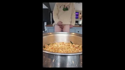 Hoodie guy stands over steaming ramen pot, dick tip brushing hot pan