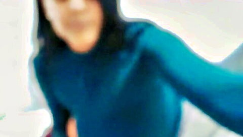 Blurry selfie of big tits MILF in teal sweater cam show