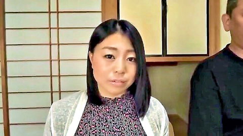 Japanese woman with black bob hair in cardigan and floral top beside man in black shirt, JAV couple teaser
