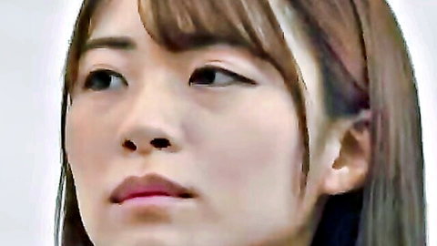 Close-up portrait of seductive Asian woman with long brown hair and bangs