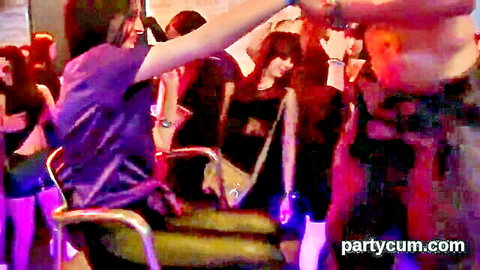 Young Asian teens dancing wildly and stripping at a nude party rave